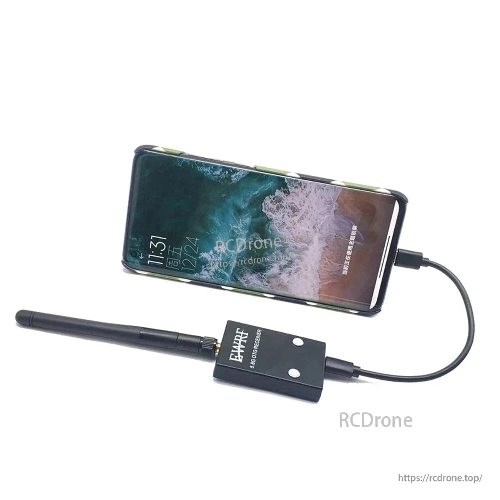 Smartphone connected to 5.8G OTG receiver and antenna, showing typical FPV receiver use
