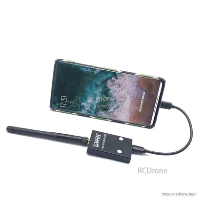 Smartphone connected to 5.8G OTG receiver and antenna, showing typical FPV receiver use