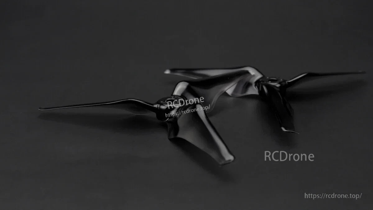 Close view of black 3-blade FPV propeller with centralized hub mass for quick RPM response