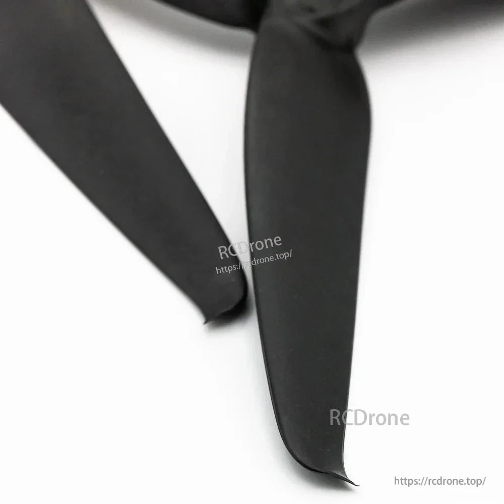 Macro view of Avia 8043 propeller blade tips, black three-blade design with curved tip profile