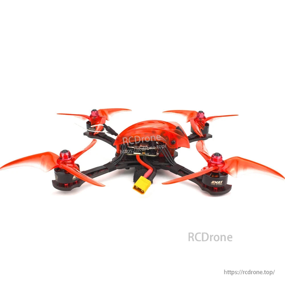 Rear underside view of the Emax Babyhawk R Pro showing XT60 battery lead and wiring under orange canopy