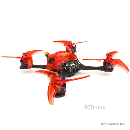 Side angle of quadcopter showing camera housing, top-mounted antenna, and low-profile carbon frame layout