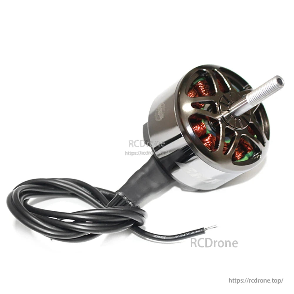 Angled top view of motor with coiled lead wires, showing vented bell design and shaft length
