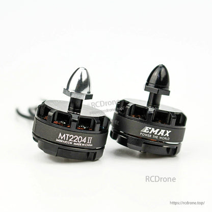 Two MT2204 II motors close-up with silver and black prop adapter nuts, side-by-side comparison view