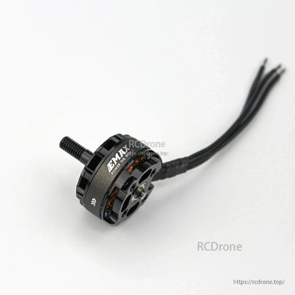 Angled view of EMAX MT2205II motor showing side vents, copper windings, and attached wires