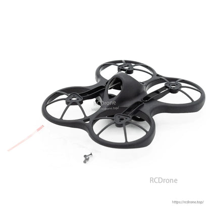 Angled view of Emax Tinyhawk 75mm ducted frame with included screws and zip tie