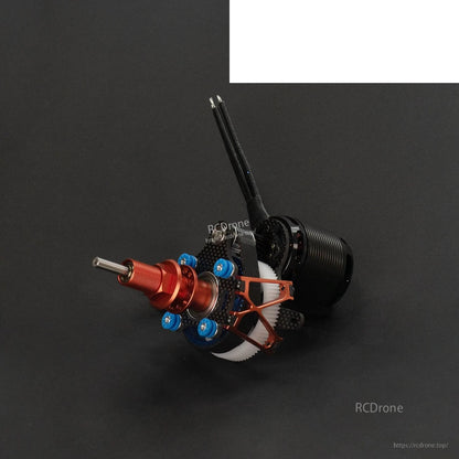 Angled view of contra drive showing red spinner hub, carbon bracing, and gear housing
