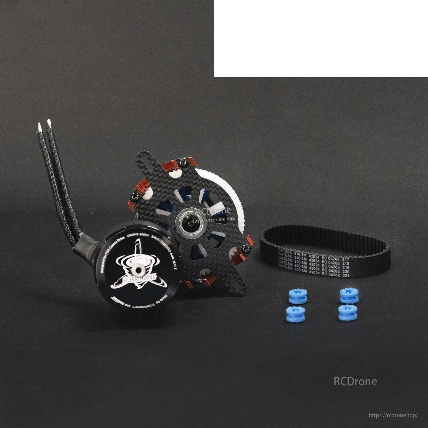 Package contents: motor with mount plate, toothed belt, and four blue standoffs/spacers