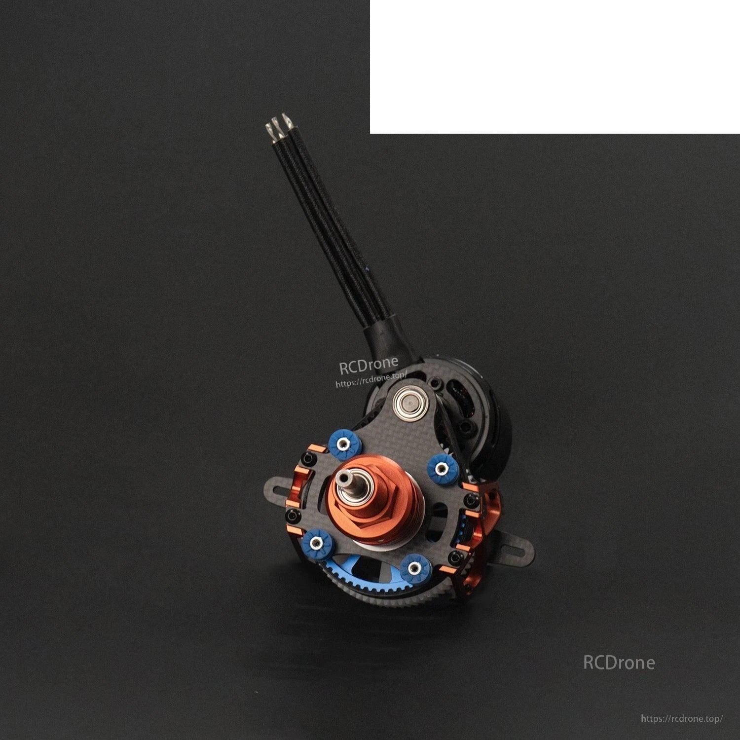 Front face view of contra drive showing red hub, blue fasteners, and carbon mounting plate