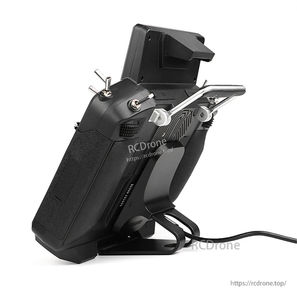 Side profile of the transmitter showing folding stand and metal handle bracket