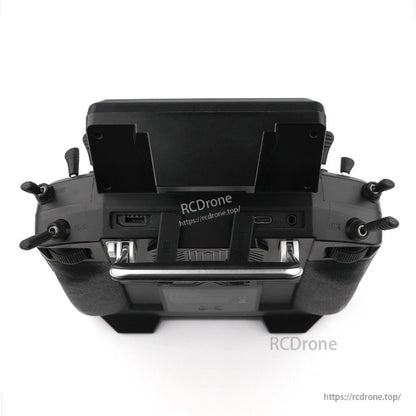 Top edge close-up showing ports and switches beneath the screen mount