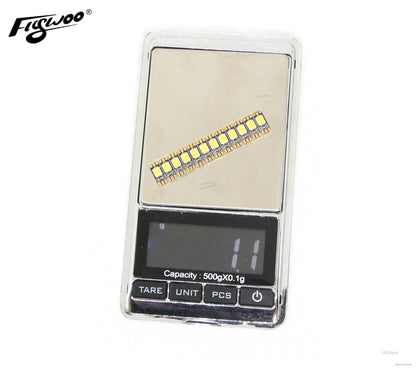 FLYWOO 12PCS 4x10mm Arm LED Board Light, Flywoo arm LED board light strip with multiple SMD LEDs, shown on a digital scale reading 1.1g