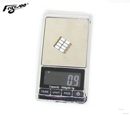 FLYWOO 4PCS 4x20mm Arm LED Board Light, Flywoo 4x20mm FPV drone arm LED board on a digital scale, weighing 0.9 g