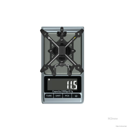FLYWOO Flybee 16/20 FPV Frame, FLYWOO Flybee FPV drone frame on a digital scale showing 11.5 g weight, with X-style carbon plate layout