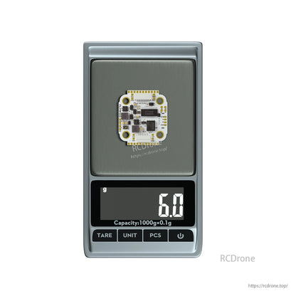 FLYWOO GOKU F722 Pro Mini V2 flight controller on a digital scale showing 6.0 g weight