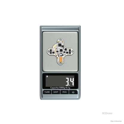 FLYWOO GOKU F405 HD 1S AIO FC/ESC board on a digital scale showing 3.4 g weight