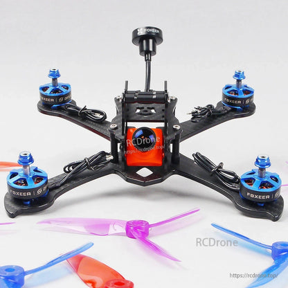 FOXEER Pagoda PRO 5.8G RHCP omni FPV antenna mounted on a quadcopter with a short coax pigtail