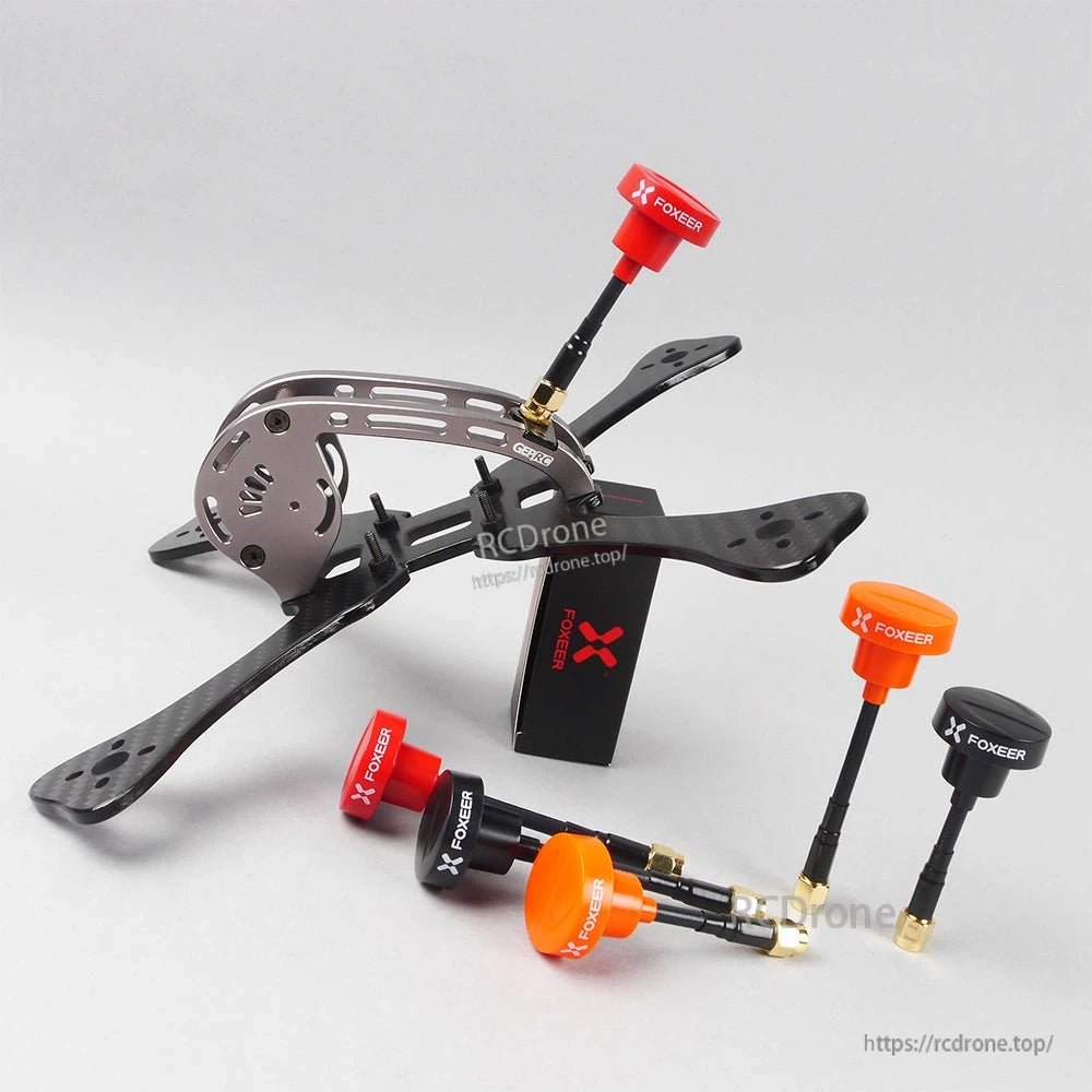 FOXEER Pagoda PRO 5.8G RHCP Omni FPV Antenna, FOXEER Pagoda Pro FPV omni antenna with SMA connector, shown in red, orange, and black on a drone frame