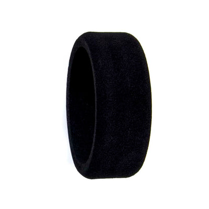 Black foam steering wheel cover, side profile showing thickness and smooth outer surface
