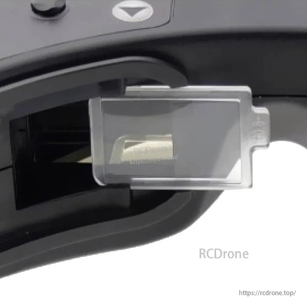 Installed diopter lens view in analog FPV goggles, showing lens tab and holder fit (RCDRone watermark)