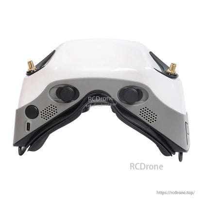 Bottom/front view showing adjustment dials, vent holes, and a USB-C port on the goggles