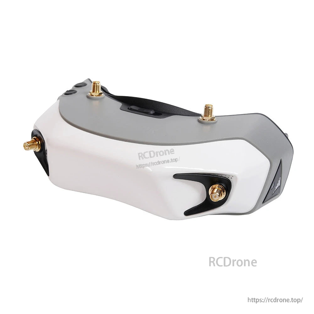Side profile view showing top controls and corner antenna connector mount on the goggle housing