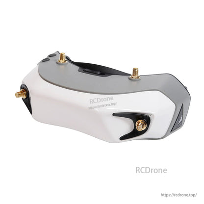 Side profile view showing top controls and corner antenna connector mount on the goggle housing