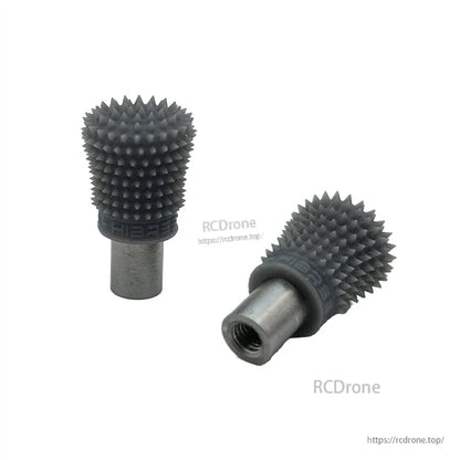 FeliStick dark gray spiked thumb stick end, close-up showing grip texture and metal insert