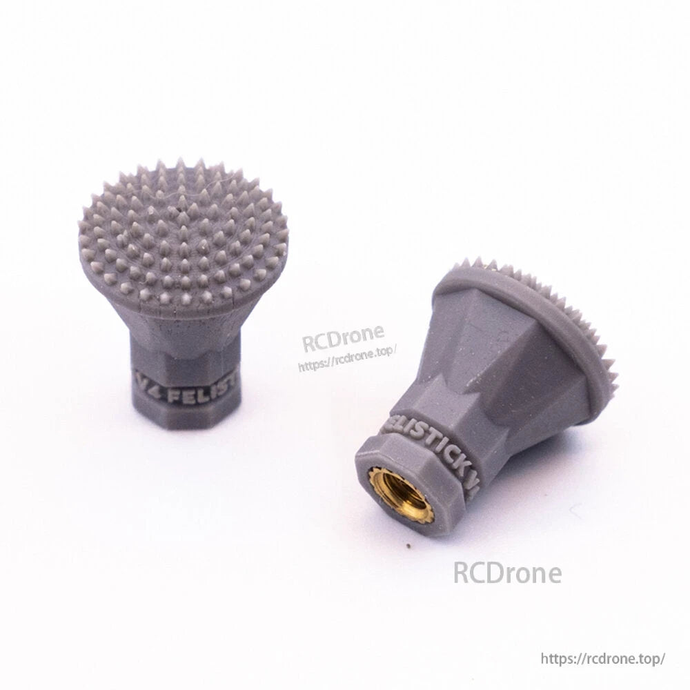 Gray flared-top spiked stick end grips, pair view with FeliStick branding and brass insert