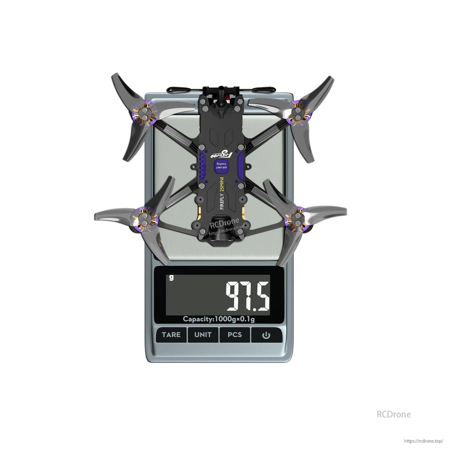 Firefly 25MINI micro drone on a digital scale, showing a 97.5 g weight with four propellers installed