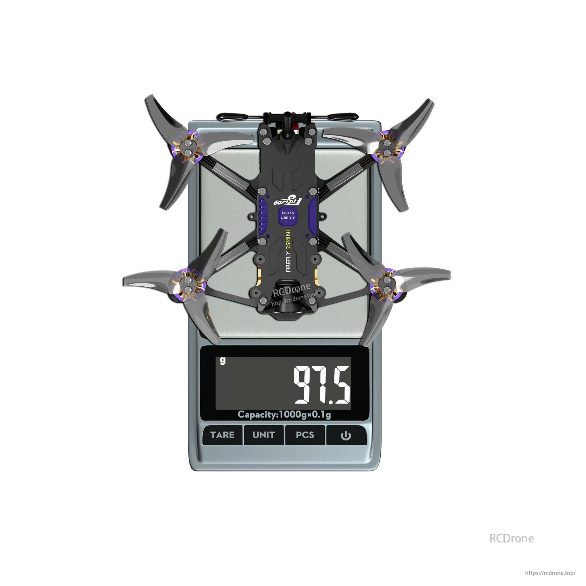 Firefly 25MINI micro drone on a digital scale, showing a 97.5 g weight with four propellers installed