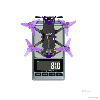 Firefly 20PRO micro FPV drone with purple tri-blade props on a digital scale reading 81.0 g