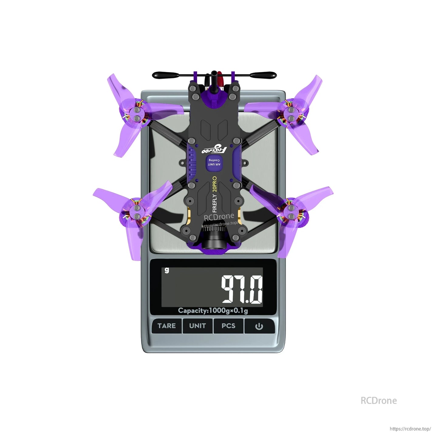 Top-down view of a micro FPV drone with purple propellers on a digital scale reading 97.0 g