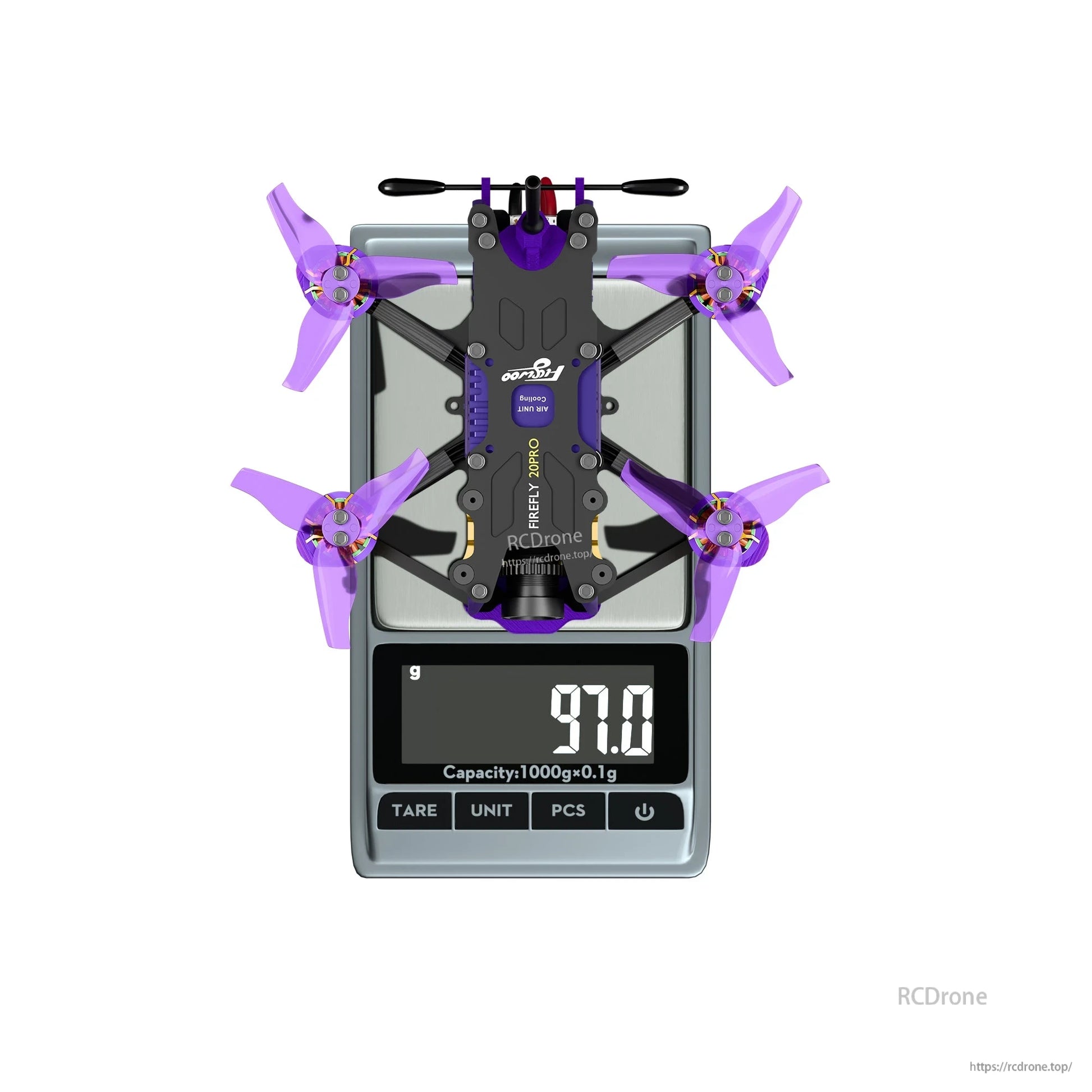Top-down view of a micro FPV drone with purple propellers on a digital scale reading 97.0 g