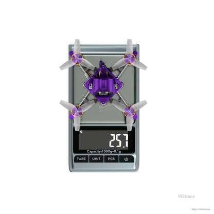 Firefly16 1S Nano Baby V3 tiny quadcopter in purple canopy on a digital scale reading 25.7 g