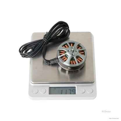 Flashhobby 4108 Brushless DC Motor, Flashhobby 4108 brushless outrunner motor with lead wires on a digital scale reading 117.9 g