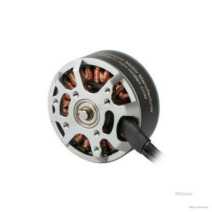 Flashhobby 4112 brushless DC motor close-up with silver housing, exposed copper windings, and lead wires