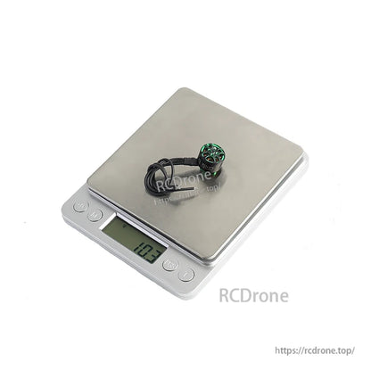 Flashhobby Arthur A1207 brushless DC motor on a digital scale, displaying a weight of 10.3 g