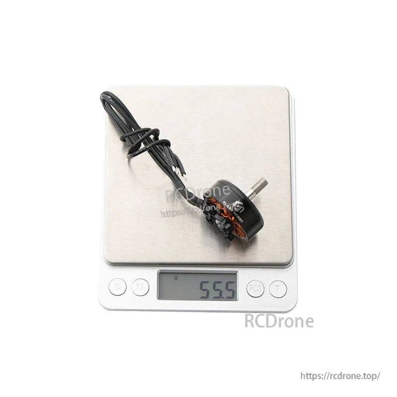 Flashhobby Arthur A2808 KV1100 brushless motor with attached wires on a digital scale reading 55.5 g