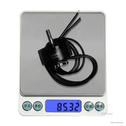 Flashhobby Arthur A3110 900KV Brushless Motor, Flashhobby Arthur A3110 brushless motor with long wires on a digital scale reading 85.32 g (700KV label)