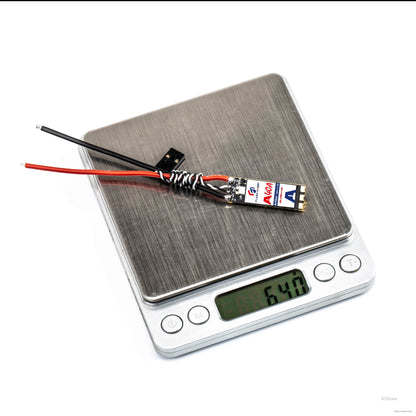 Flashhobby Arthur A40A slim brushless ESC with power and signal wires on a digital scale reading 6.40 g