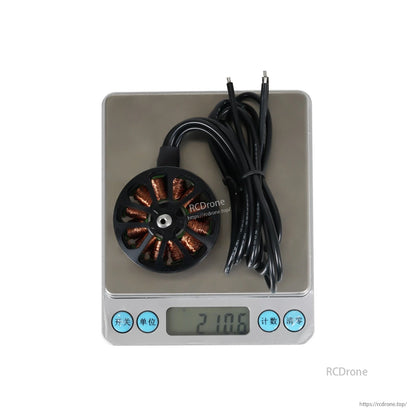 Flashhobby Arthur A4312 380KV Brushless Motor, Flashhobby Arthur A4312 brushless motor with long lead wires, sitting on a digital scale reading 210.6 g