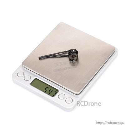 Flashhobby BE 1104 brushless DC motor on a digital scale with display reading 6.43 g