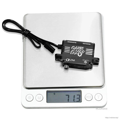 Flashhobby BLS2940MED low-profile brushless digital servo on a scale, showing 71.3g weight and lead cable