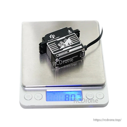 Flashhobby BLS4058RP Servo, Flashhobby BLS4058RP brushless servo labeled 66kg 8.4V, photographed on a digital scale showing about 80g