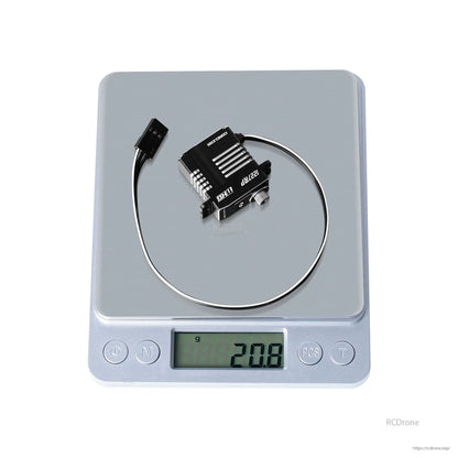 Flashhobby CLS1227RP micro digital servo with aluminum case and lead wire on a scale reading 20.8 g