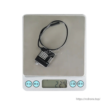 Flashhobby CLS1227RP V2 micro digital servo on a digital scale showing 22.0 g weight