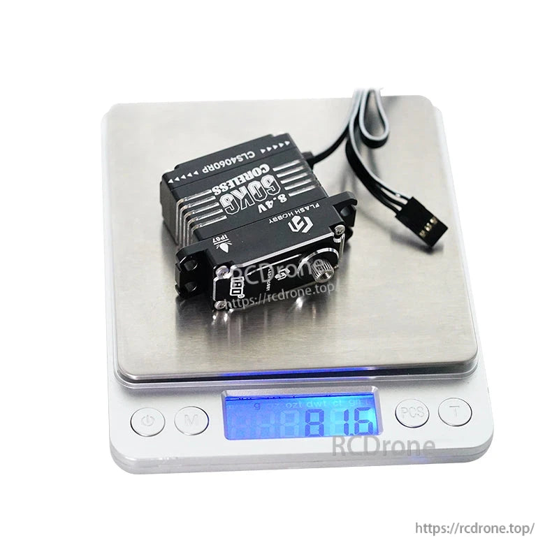 Flashhobby CLS4060RP digital coreless servo with mounting tabs and 3-pin lead on a scale reading 81.6 g