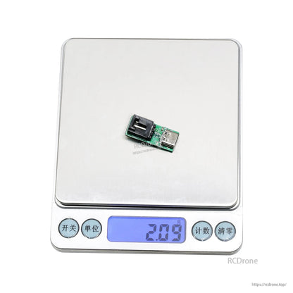 Flashhobby ESC USB linker programmer board with USB-C port and socket connector on a scale reading 2.09g