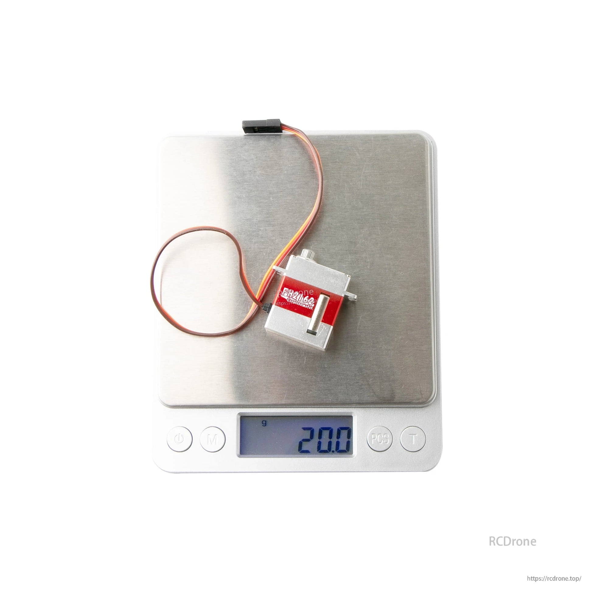 Flashhobby FH-2162 micro servo with 3-wire lead on a digital scale showing 20.0 g weight